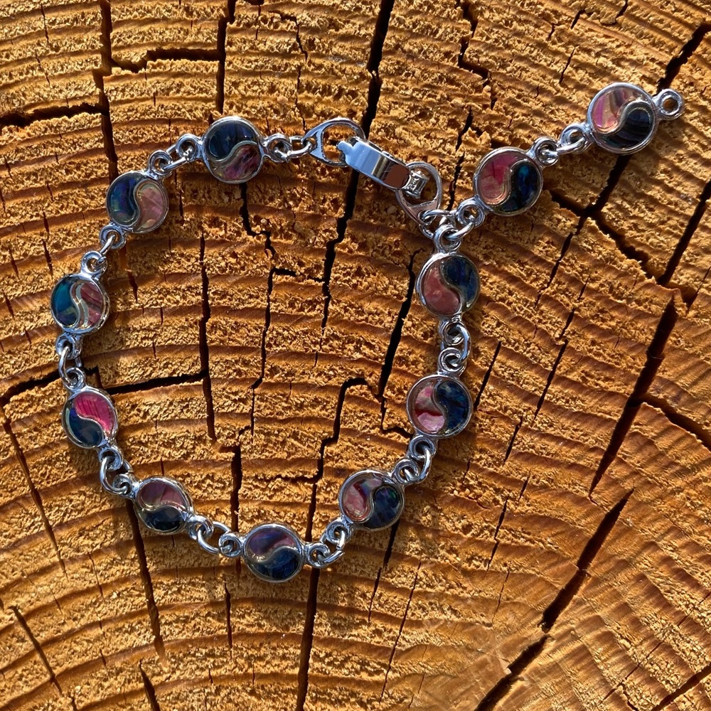 Yin-yang silver and shell charm bracelet